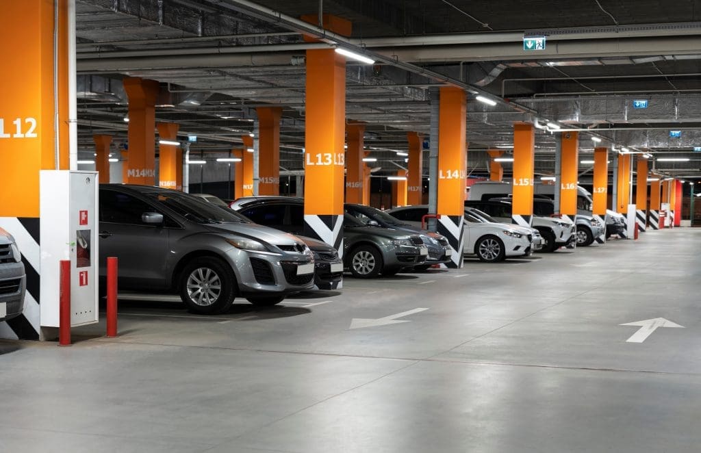 a row of cars parked in a car park
