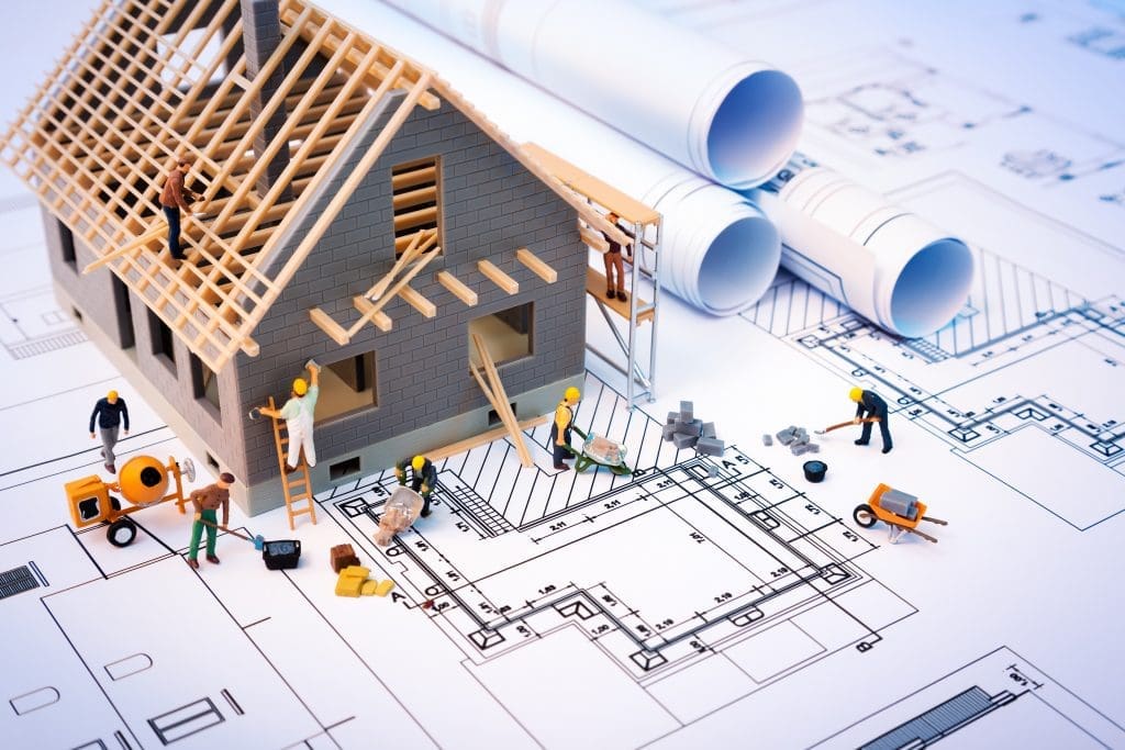 render of a blueprint showing a 3d model of a house over the top of standard blueprints for a house build