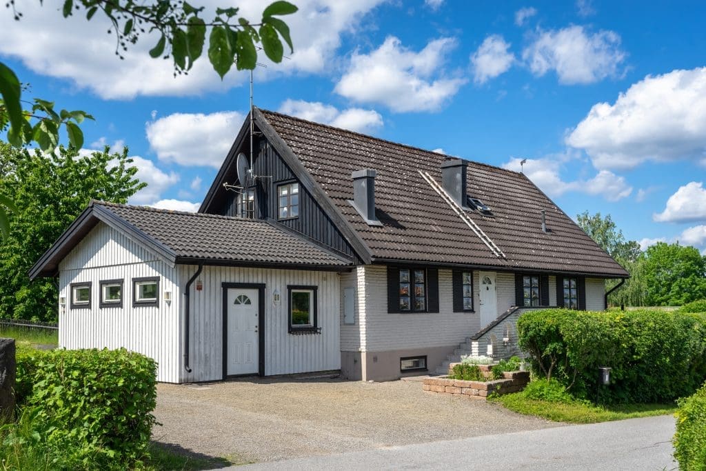 a newly renovated house with a garage extension