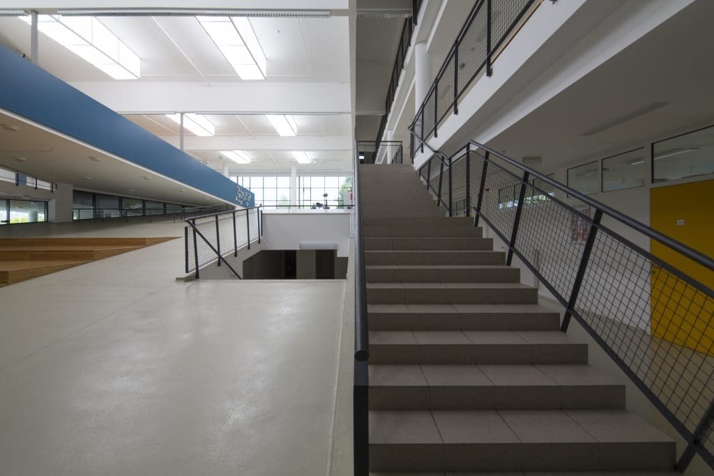 Interior image of a school hallway showing two staircases