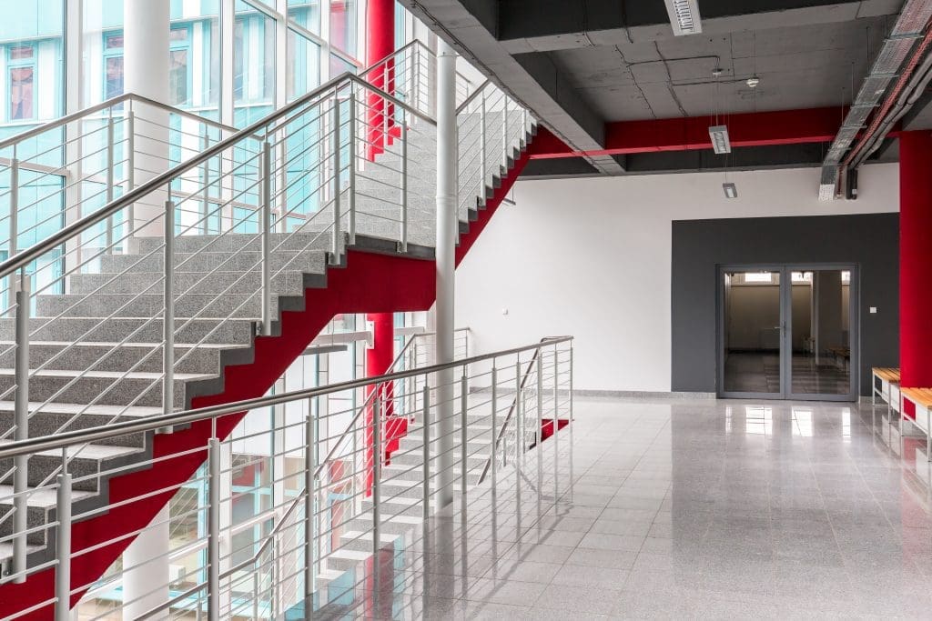 interior shot of an office space with a staircase and doorway in shot